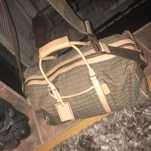 Coach Duffle.... Measurements 22” wide by 11” deep